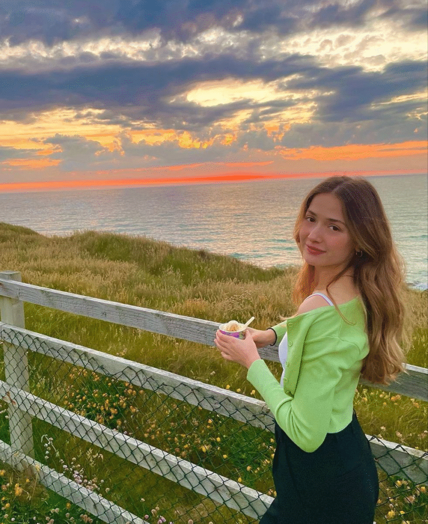 A serene sunset moment with Zeliha Akpinar, quietly reflecting on how to build discipline through presence, peace, and purpose.